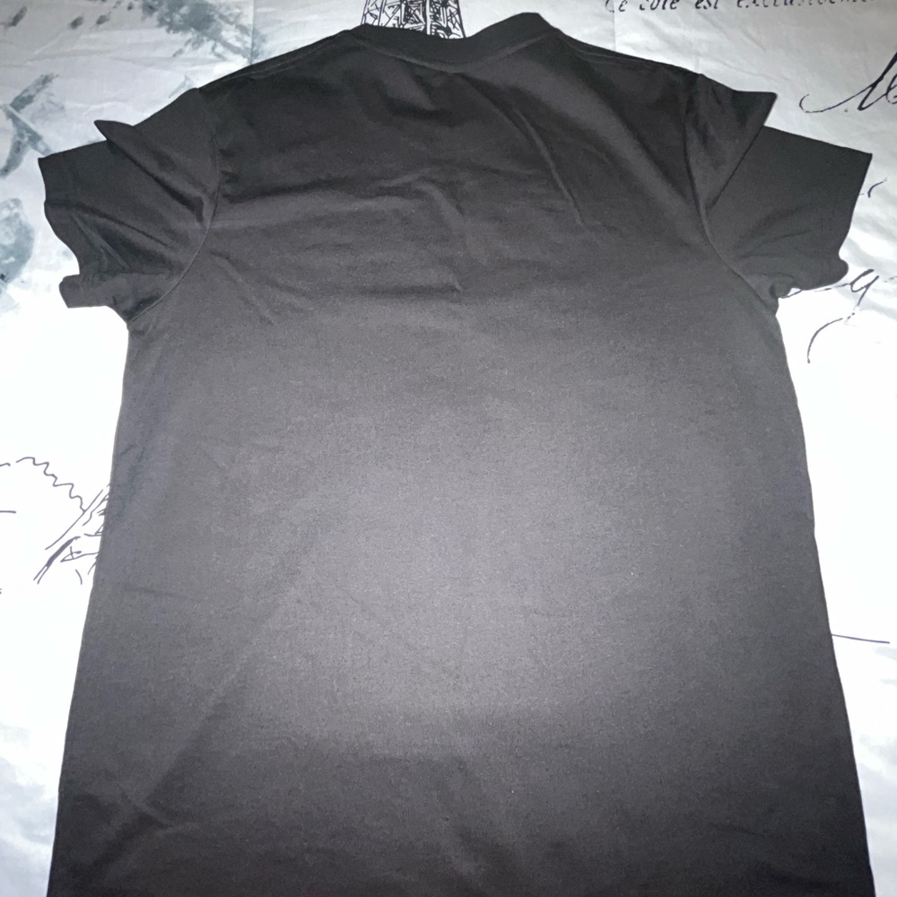 Here I'm selling a red and black shirt from SHEIN.